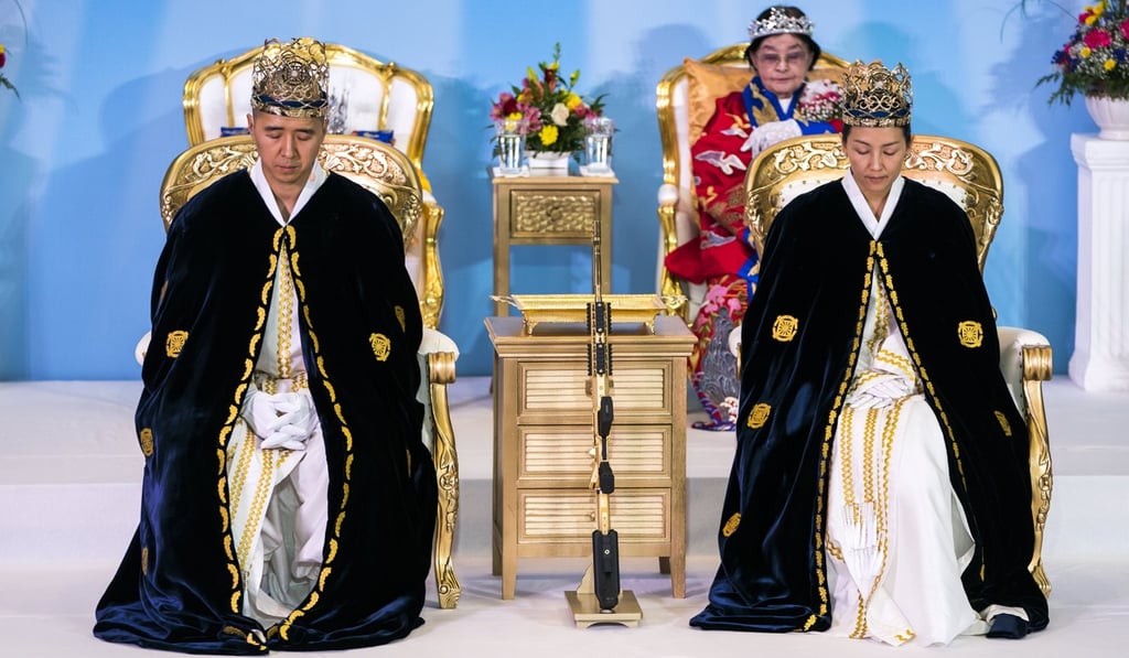 Reverend Hyung Jin-moon (left), and his wife Reverend Yeon Ah Lee-moon (right), leaders of the Sanctuary Church, participate in the ceremony to rededicate marriages. Photo: EPA-EFE