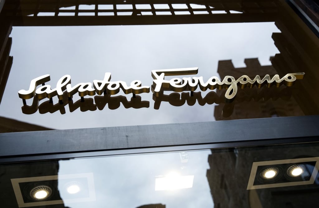 A logo sits above the entrance to a Salvatore Ferragamo store in Florence, Italy. Photo: Alessia Pierdomenico/Bloomberg