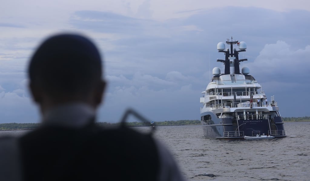 Indonesian officials prepare to board the luxury yacht Equanimity, reportedly owned by Jho Low, a former unofficial adviser to the Malaysian fund 1MDB. Photo: AFP Indonesian officials prepare to board the luxury yacht Equanimity, reportedly owned by Jho Low, a former unofficial adviser to the Malaysian fund 1MDB. Photo: AFP