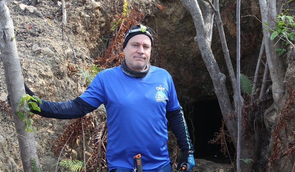 Robert Lockyer in front of a Japanese tunnel entrance on Lamma Island. Photo: Roy Issa