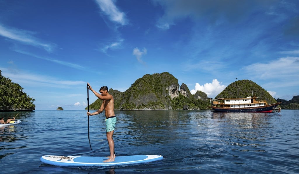 Take to the tropical waters aboard a stand up paddle board.