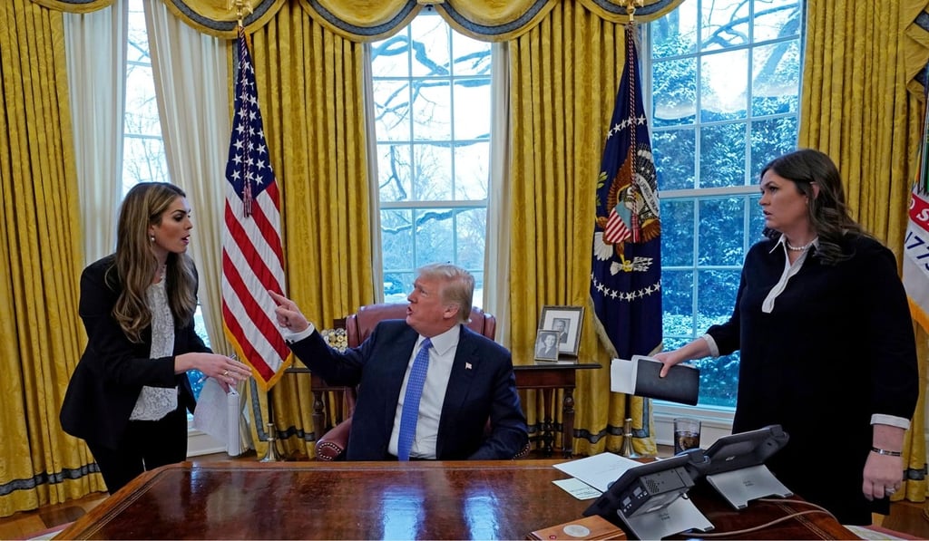 US President Donald Trump confers with Hicks (left) as White House Press Secretary Sarah Sanders (right) listens on January 17. Photo: Reuters