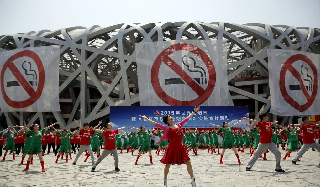 Cigarettes can be bought for as little as three to five yuan a packet in most Chinese cities and rural areas. Pictured: Dancers perform in front of antismoking banners on World No Tobacco Day in Beijing. Photo: Xinhua