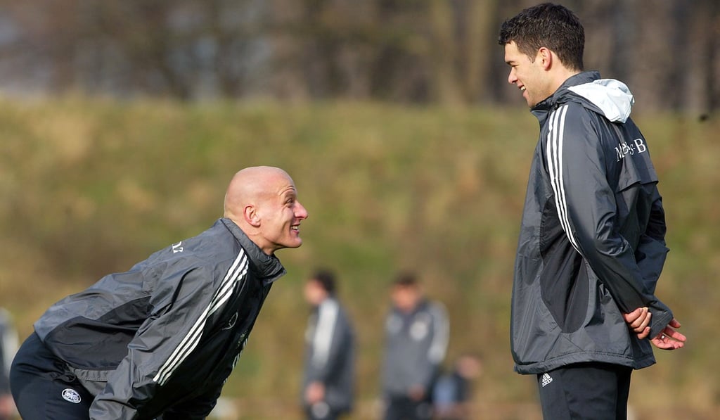 Germany’s Carsten Jancker jokes with Michael Ballack during a training session. Photo: AP