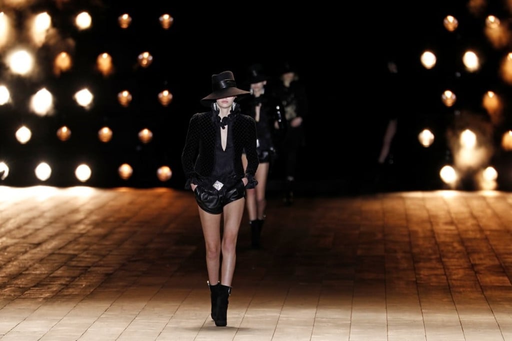 Models opened the show with barely there leather hot pants matched with sleek Le Smoking jackets. Photo: Reuters
