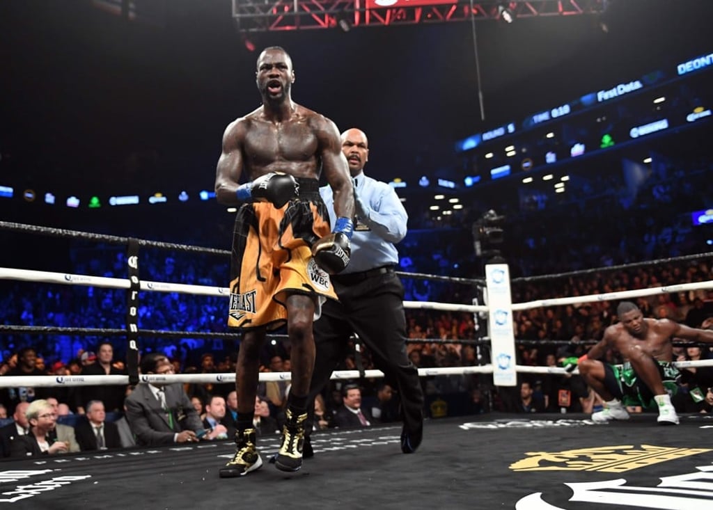 Heavyweight champion Deontay Wilder is sent to his corner after knocking down Luis Ortiz in round five. Photo: AFP Heavyweight champion Deontay Wilder is sent to his corner after knocking down Luis Ortiz in round five. Photo: AFP