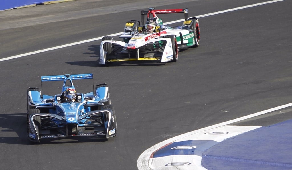 Swiss driver Sebastian Buemi (left) and Daniel Abt compete. Photo: EPA