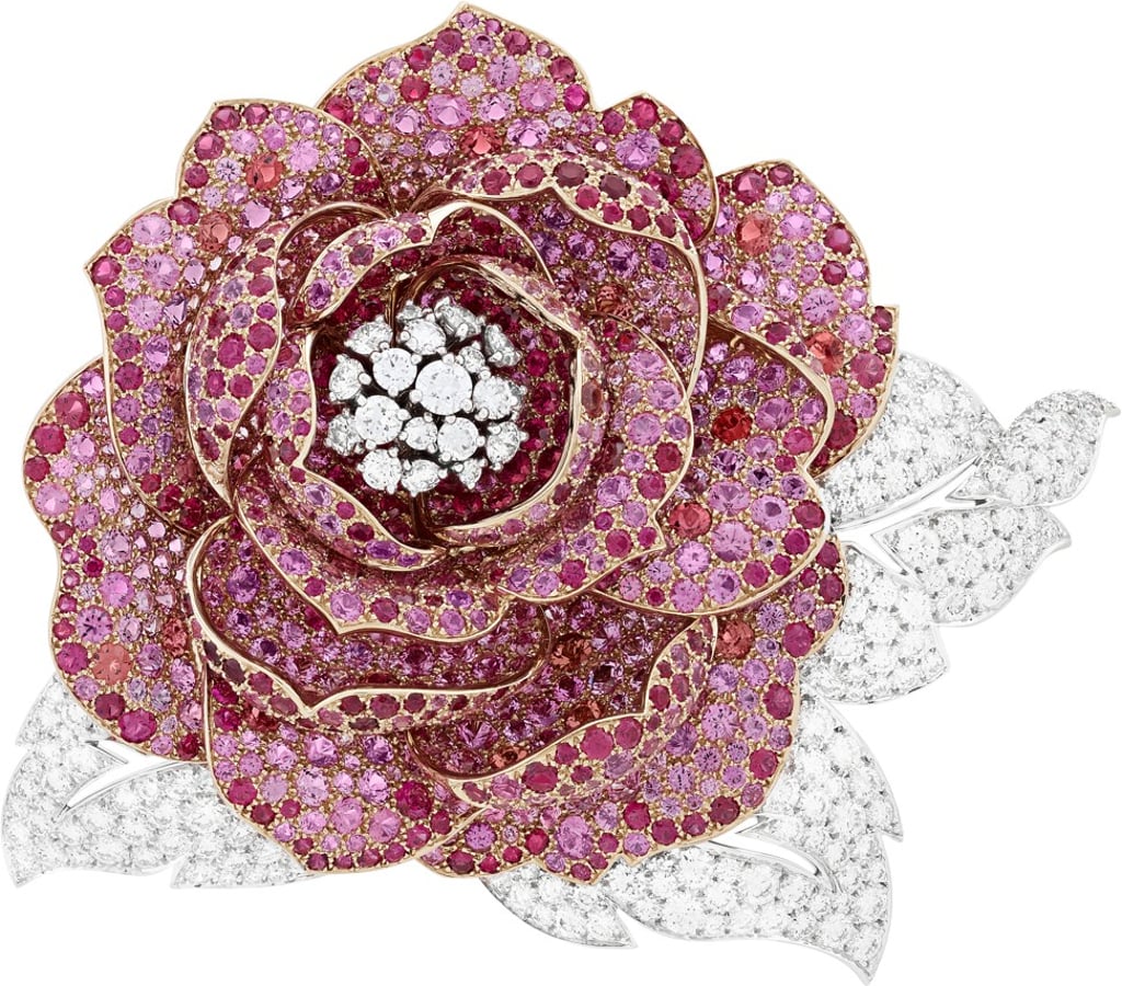 Van Cleef & Arpels. The elegant Pivoine Spinelle clip, in the shape of a peony, is set in white and pink gold. It is adorned with round diamonds, and round pink, red and peach-coloured spinels. Price on request