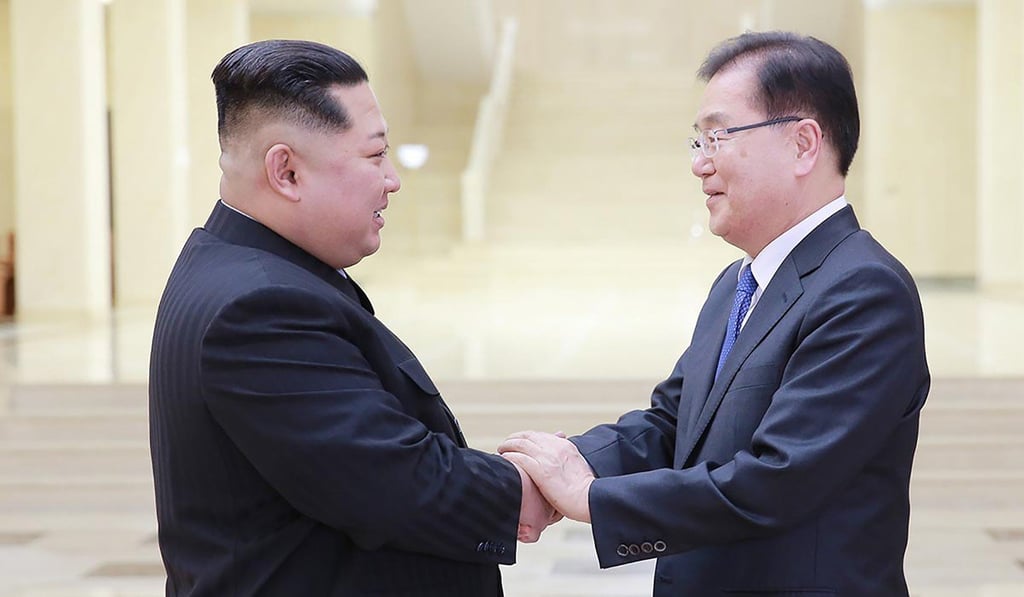This handout from the presidential Blue House taken on March 5 shows North Korean leader Kim Jong-un (left) shaking hands with South Korean chief delegator Chung Eui-yong, who travelled as envoys of the South's President Moon Jae-in, during their meeting in Pyongyang. Photo: Agence France-Presse