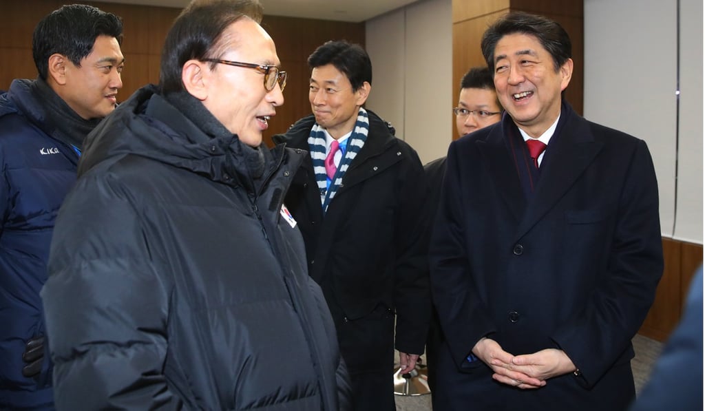 Lee with Japanese Prime Minister Shinzo Abe at the opening ceremony of the PyeongChang Winter Olympics in February, 2018. Photo: EPA Lee with Japanese Prime Minister Shinzo Abe at the opening ceremony of the PyeongChang Winter Olympics in February, 2018. Photo: EPA