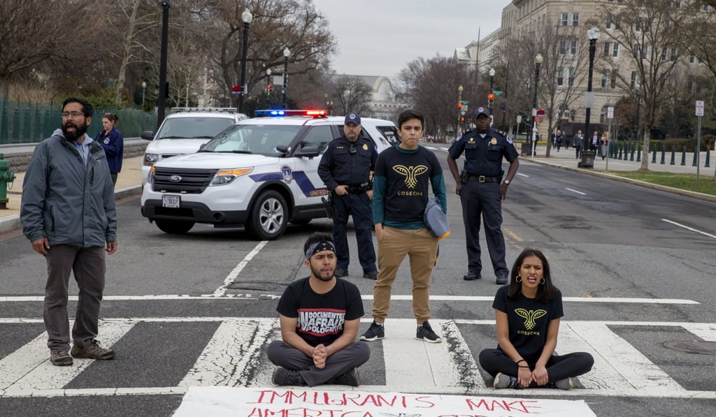 Undocumented youth and their allies shut down a street after a 250-mile Walk to Stay Home in Washington on March 1, 2018 as their fate is effectively in limbo. Photo: EPA-EFE Undocumented youth and their allies shut down a street after a 250-mile Walk to Stay Home in Washington on March 1, 2018 as their fate is effectively in limbo. Photo: EPA-EFE