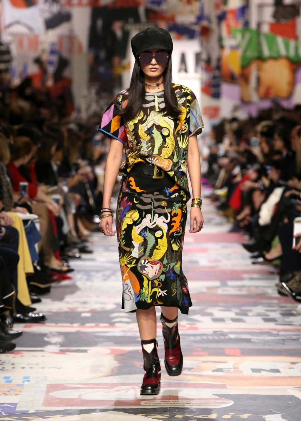 A bold and colourful dress matched with short boots from the collection