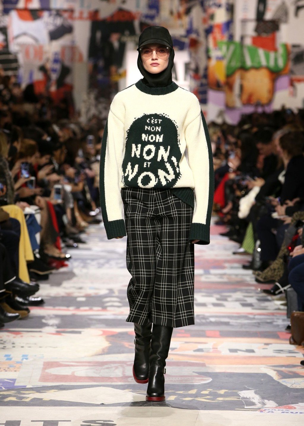 Ruth Bell opens the show with a slogan sweater that reads “C’est Non, Non, Non et Non!”– a print from Dior’s archives.