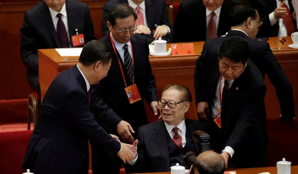 President Xi Jinping (left) shakes hands with former president Jiang Zemin after the opening of the 19th party congress in Beijing in October 2017. Jiang served as secretary general of the Community Party before taking over as president at a time when the two positions were not concurrent. Photo: Reuters