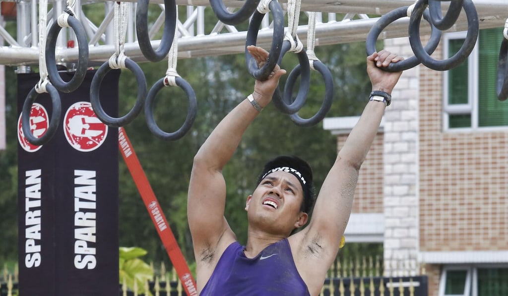 The Spartan Race involves a range of obstacles including monkey bars. Photo: Jonathan Wong