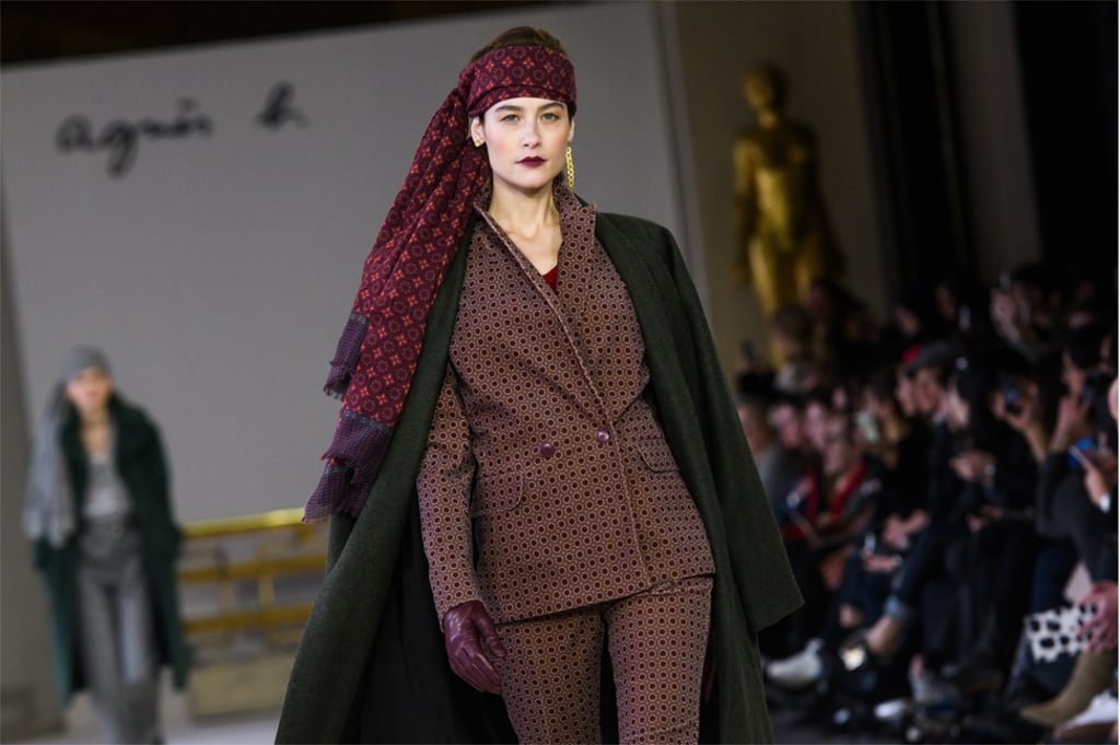 A scarf trails romantically from a model’s forehead in the Agnès b. show during Paris Fashion Week. Photo: EPA