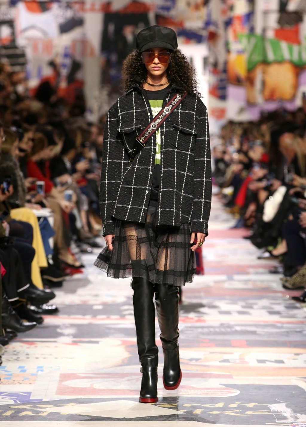 A plaid jacket is matched with a pleated transparent skirt.