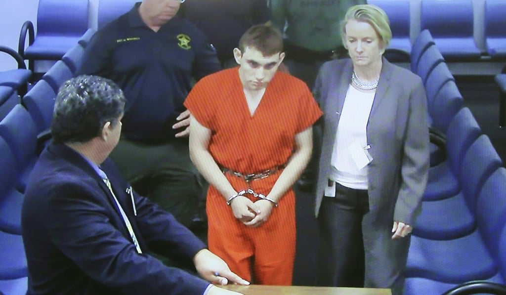 (FIIn this file photo taken on February 15, high school shooting suspect Nikolas Cruz (centre) appears at Broward County Court House in Fort Lauderdale, Florida. Photo: Agence France-Presse
