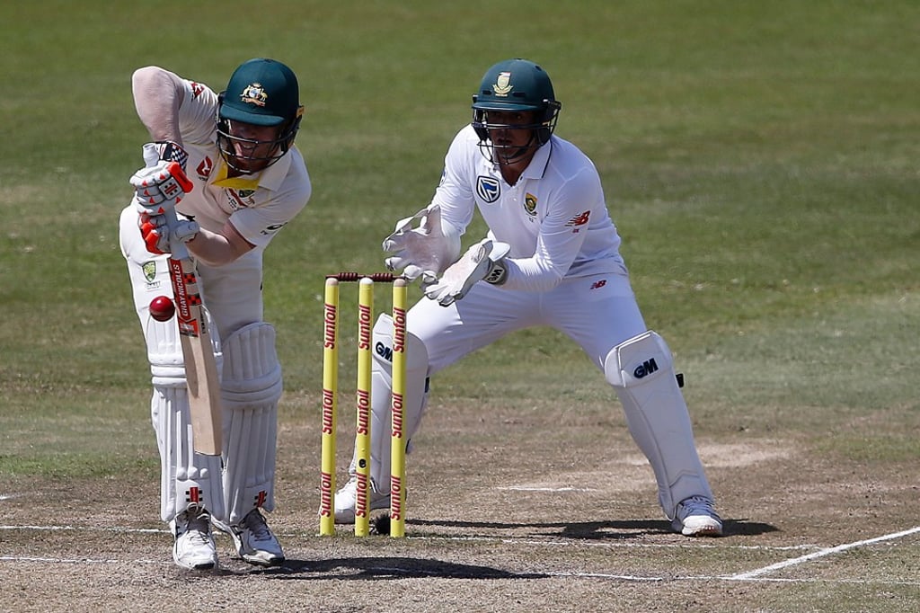 David Warner (left) and South African wicketkeeper Quinton de Kock clashed during the first test in Durban. Photo: AFP