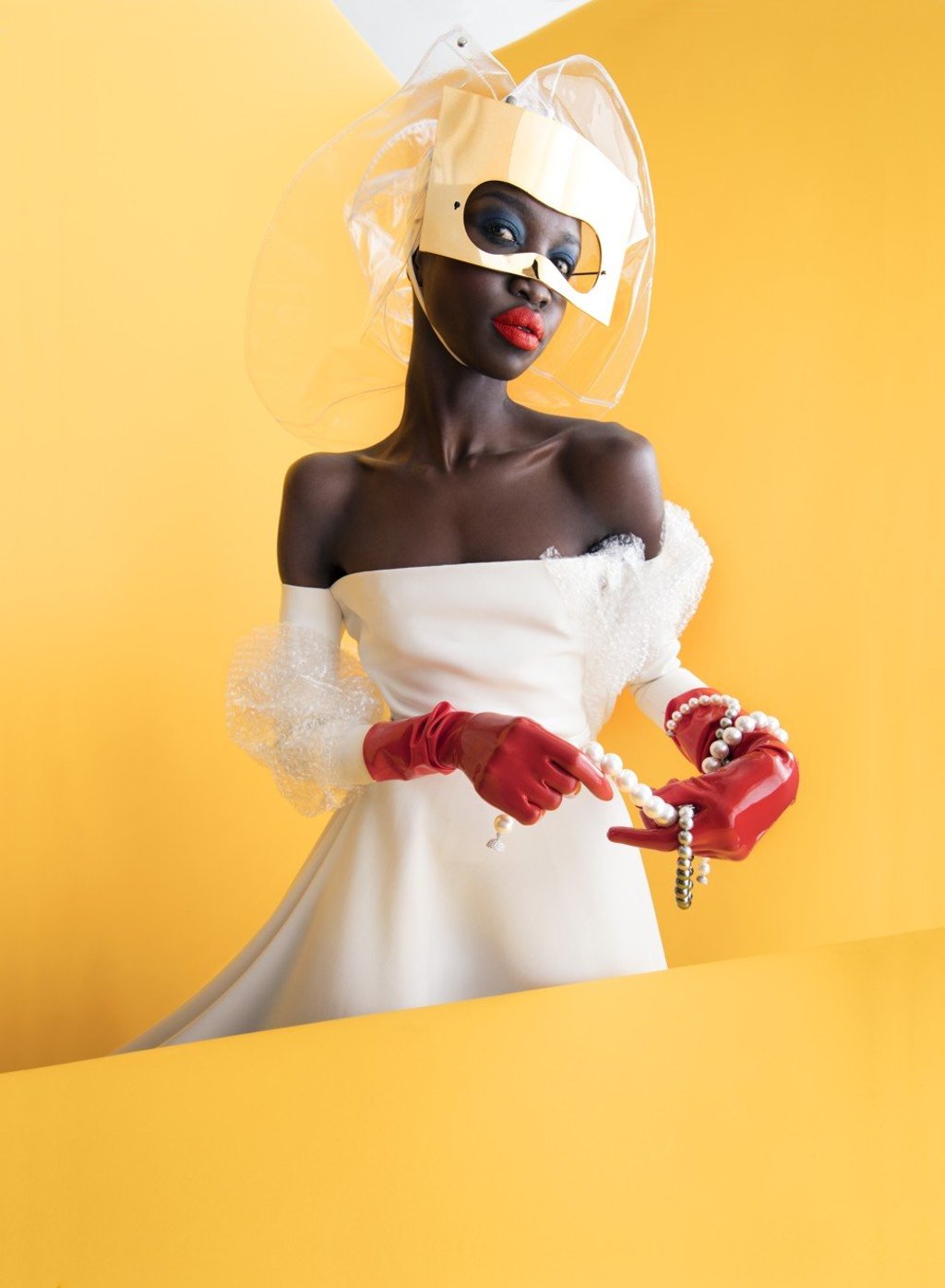 Chanel, hat, price on request; Dior Haute Couture, eye mask, dress, prices on request; Mikimoto, Graduated White South Sea cultured pearl necklace with pave ball clasp, $420,000, Ginza set: White South Sea cultured pearl necklace and earrings, $28,000, Black South Sea cultured pearl gradient necklace, $50,000, Gloves, stylist's own