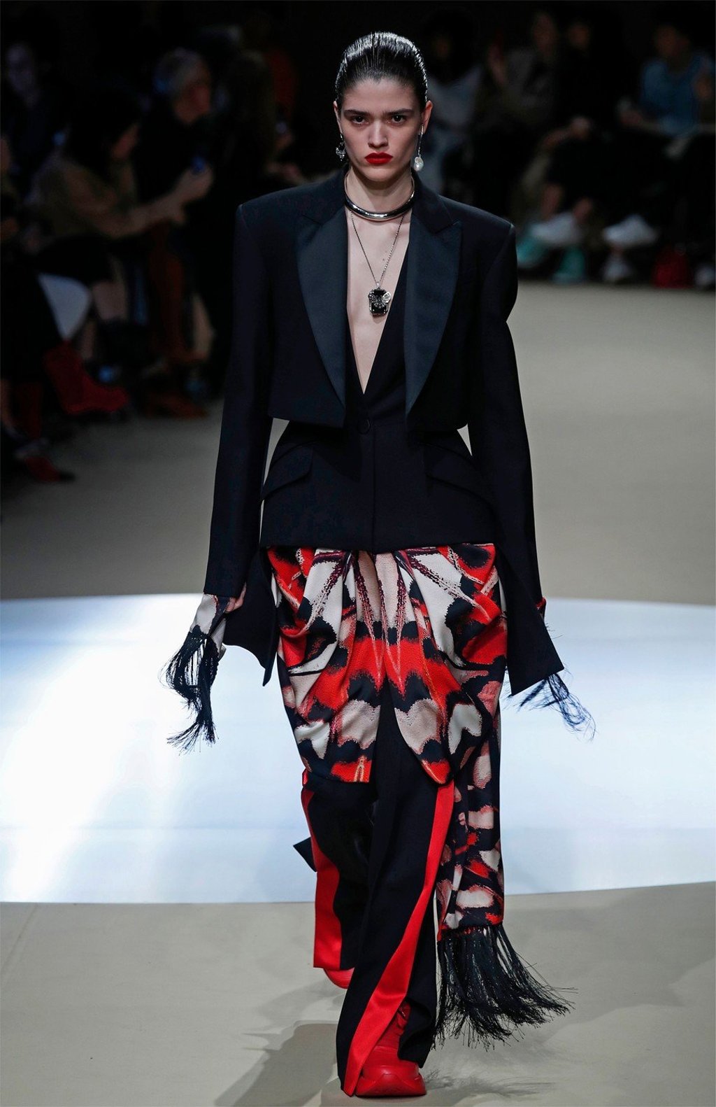 A black jacket with square shoulders creates a sharp contrast with a long and colourful fringed skirt. Photo: AFP A black jacket with square shoulders creates a sharp contrast with a long and colourful fringed skirt. Photo: AFP