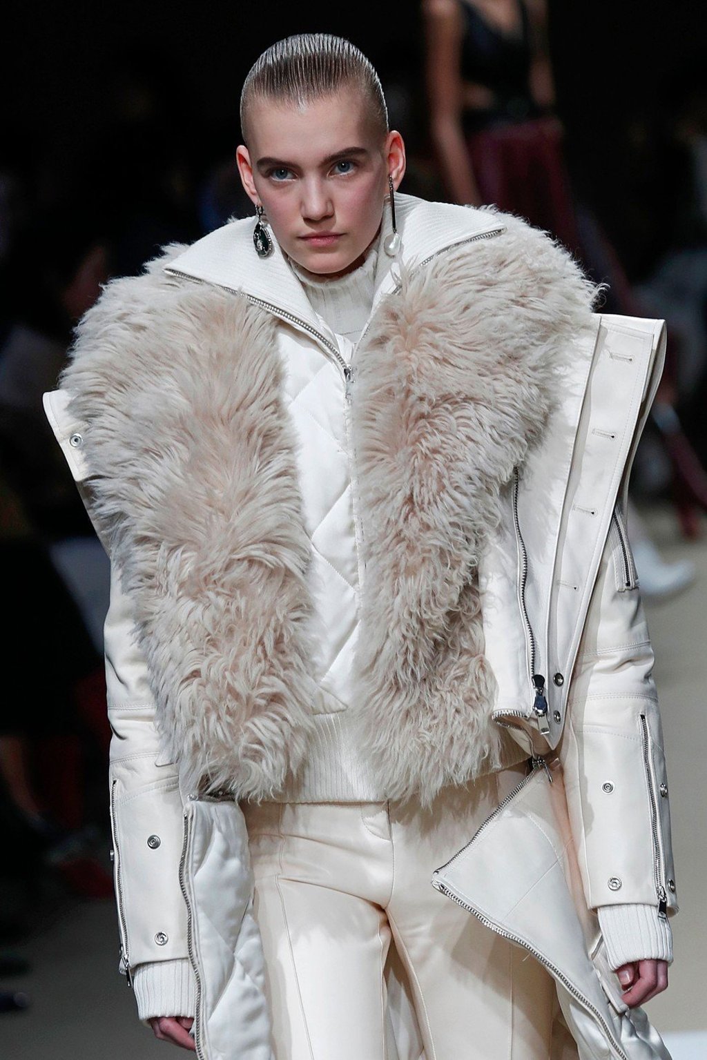 An all-white ensemble with a strong silhouette, tailored pants and fluffy details. Photo: AFP An all-white ensemble with a strong silhouette, tailored pants and fluffy details. Photo: AFP