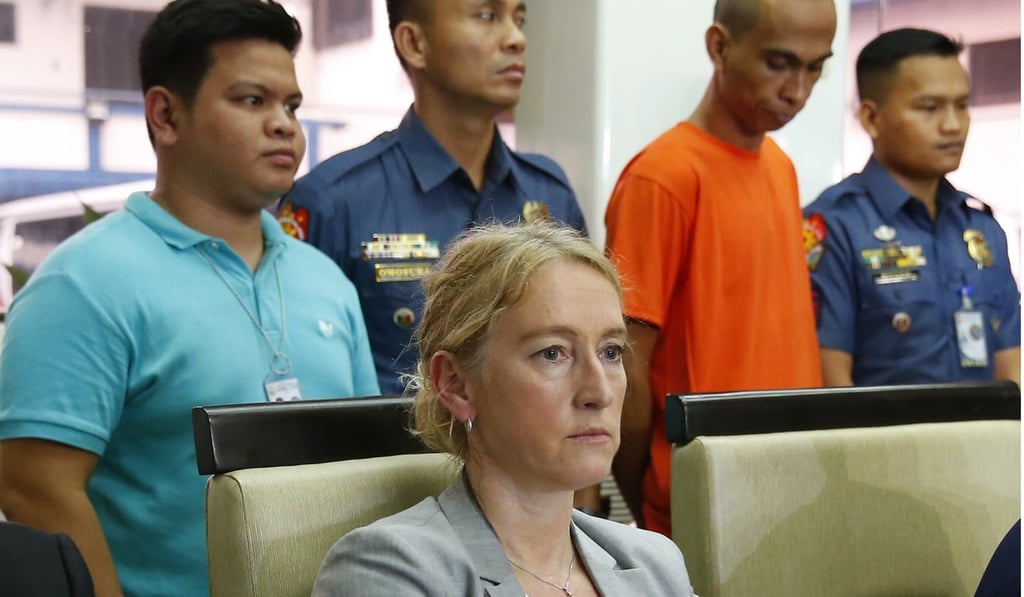Norway’s Vest Police District’s Assistant Police Chief Sidsel Isachsen sitting with National Bureau of Investigation and police officers as they present Ico in Manila, Philippines. Photo: AP