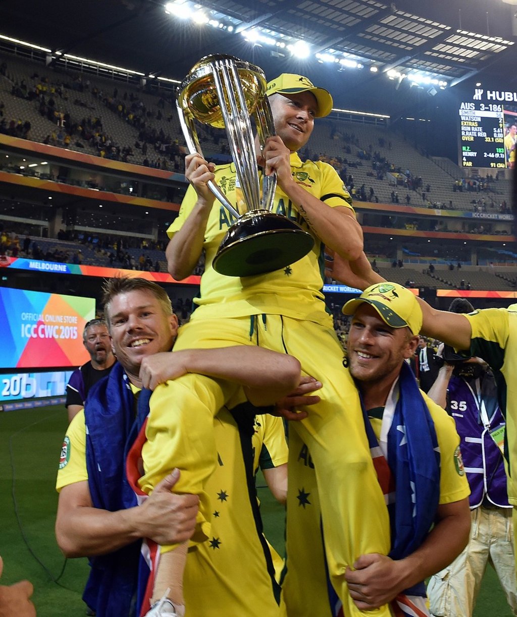Michael Clarke with the 2015 World Cup spoils. Photo: AFP