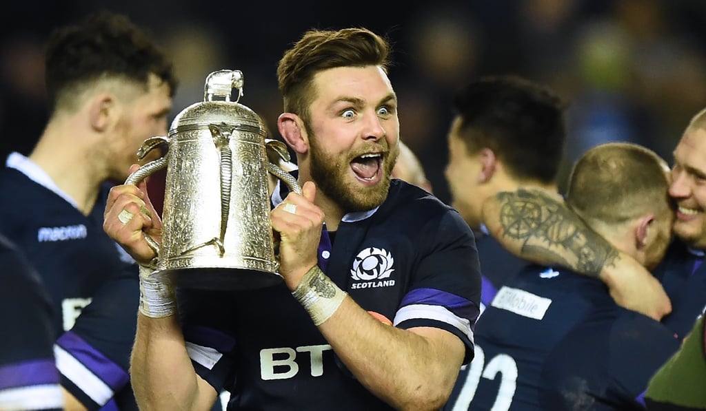 Scotland's number 8 Ryan Wilson celebrates with the Calcutta Cup at Murrayfield. Photo: AFP