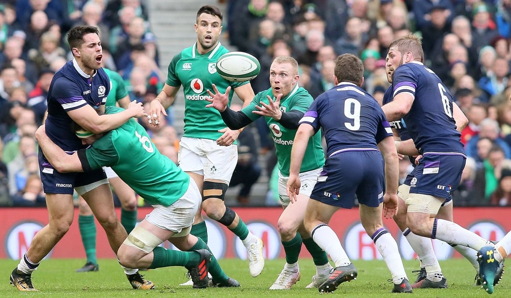 Ireland’s wing Keith Earls (centre) vies with Scotland’s scrum-half Greig Laidlaw (centre right) during their Six Nations match. Photo: AFP