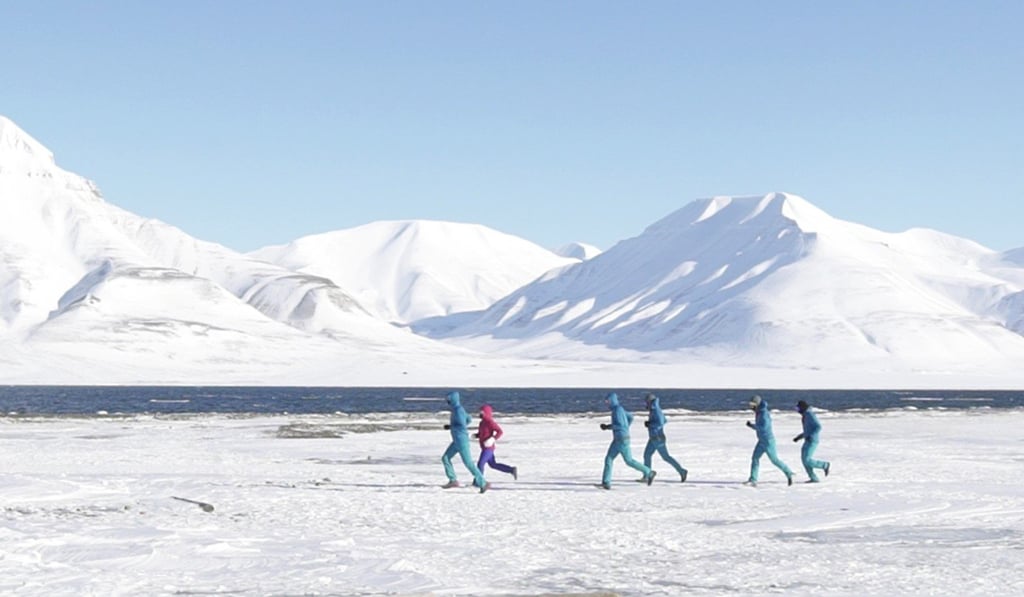 Runners face knee deep snow and sub-zero temperatures at the North Pole Marathon.