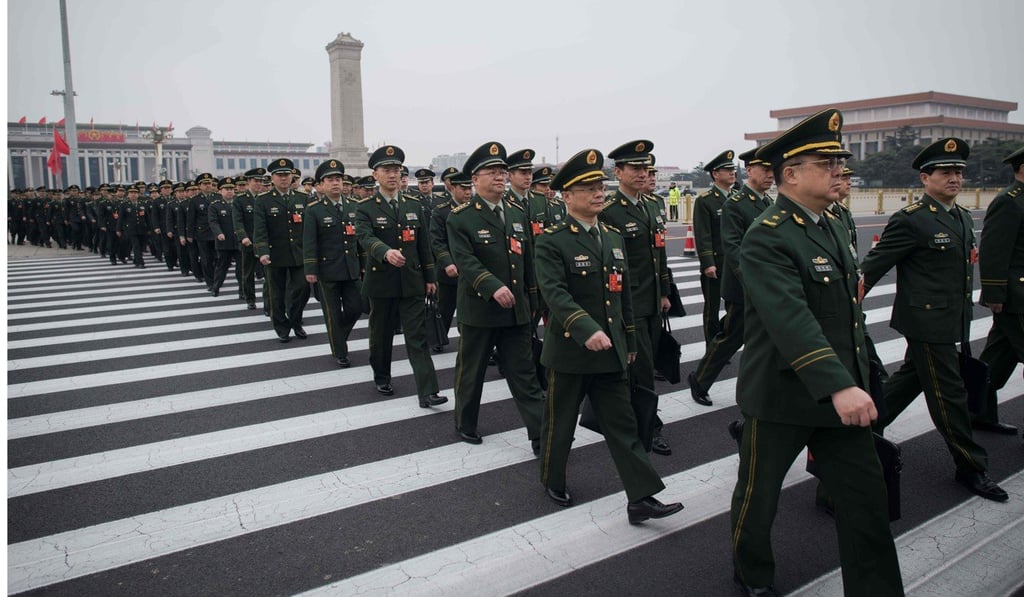 Military delegates arrive for the National People's Congress at the Great Hall of the People in Beijing. Photo: AFP