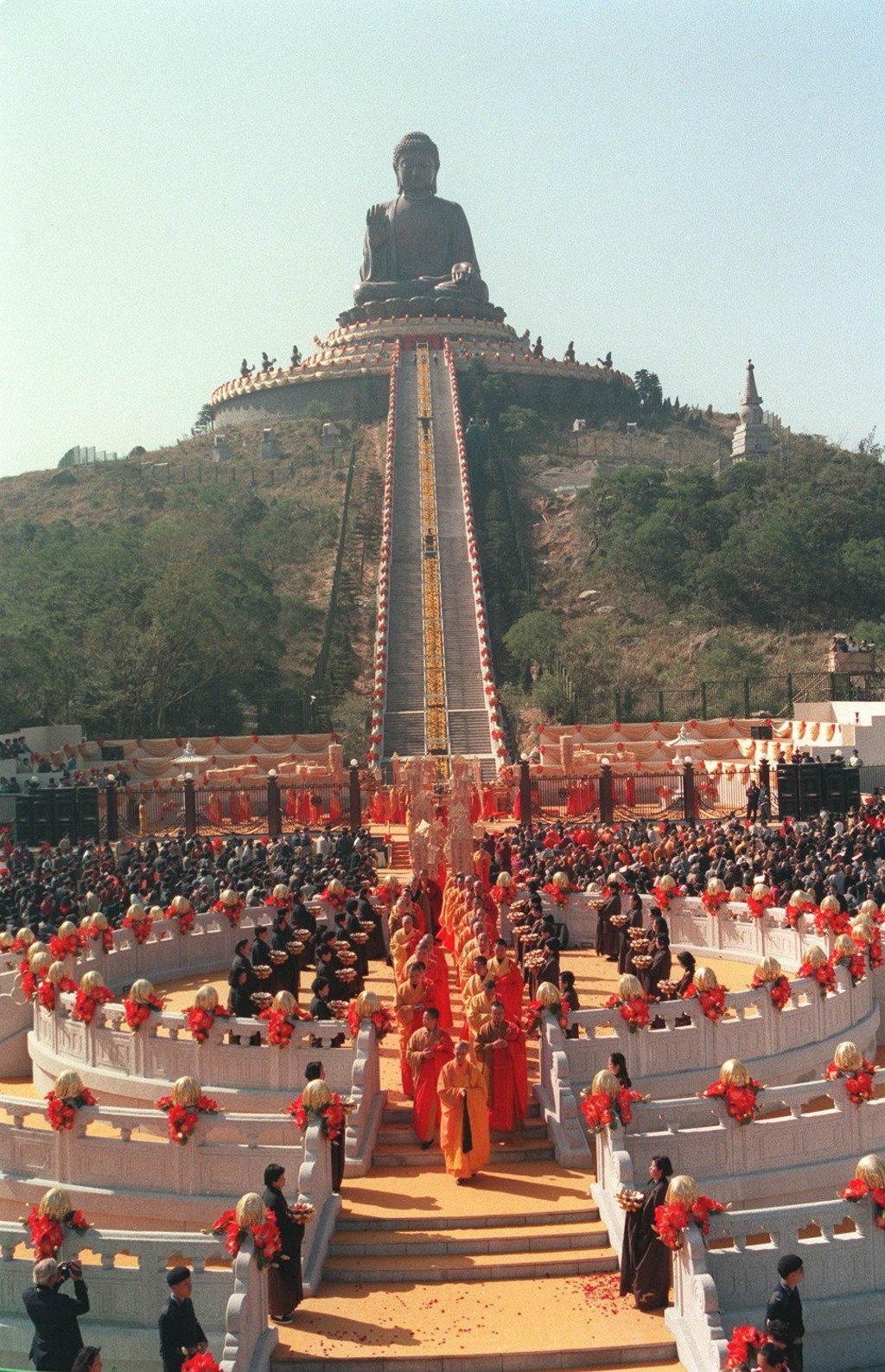 A procession of Buddhist monks moves through a crowd of 10,000 attending the colourful inauguration ceremony for the giant Tian Tan Buddha. Photo: Martin Chan