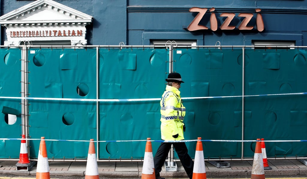 A police officer outside Zizzi. Photo: Reuters