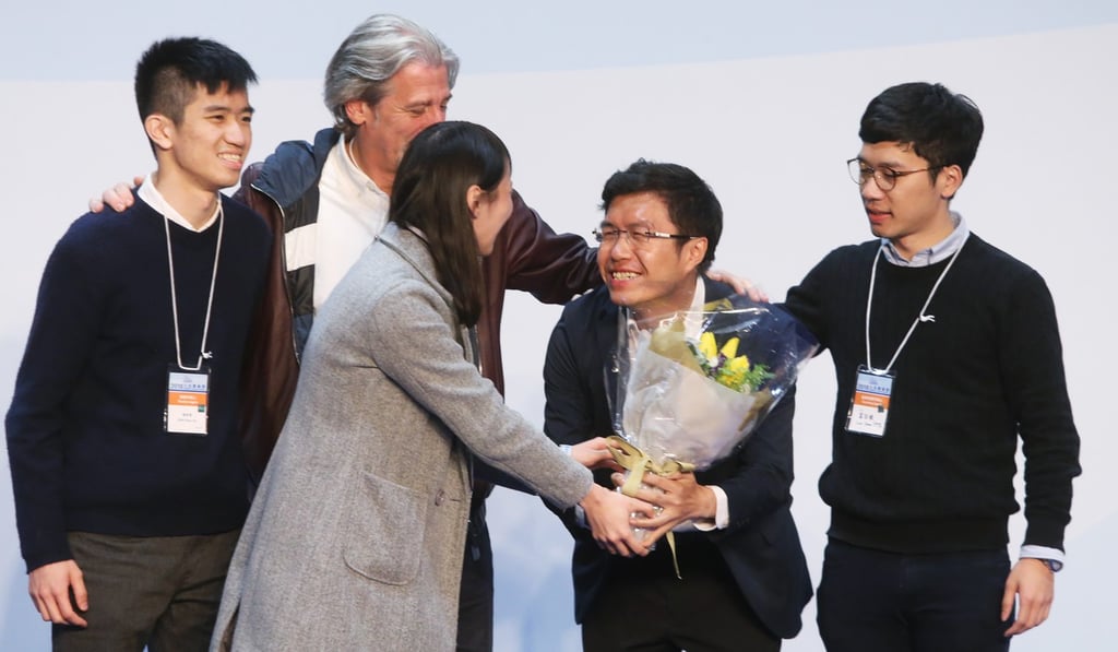 Au Nok-hin (second right) won the Hong Kong Island seat. Photo: Sam Tsang