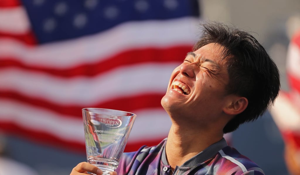 Yibing Wu of China holds the championship trophy for the Junior Boys' Singles tennis title at last year’s US Open, at the Billie Jean King National Tennis Centre in the Flushing neighbourhood of Queens in New York City. Photo: AFP