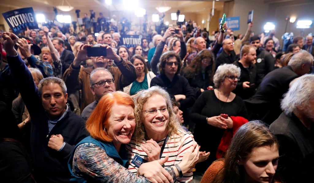 Supporters of US Democratic congressional candidate Conor Lamb react to the results coming in on Tuesday night. Photo: Reuters