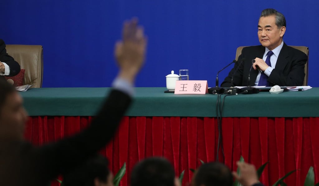 Chinese Foreign Minister Wang Yi looks on during a press conference on the sidelines of the National People’s Congress meeting in Beijing, on March 8. It has become almost impossible for reporters to get called upon at China’s official press conferences without submitting their questions in advance for screening. Photo: EPA-EFE