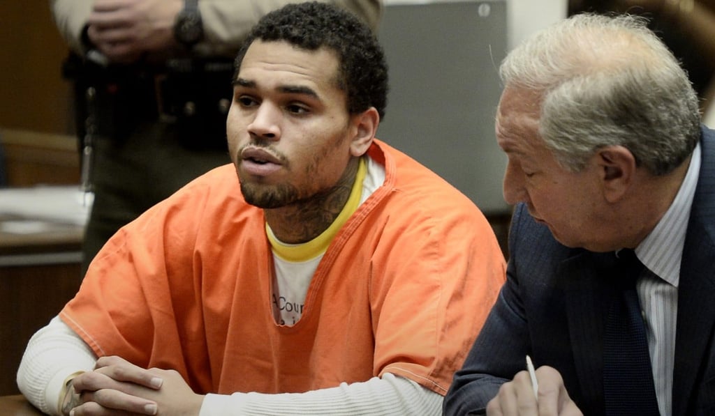 US singer Chris Brown (left) appears for a court hearing alongside his lawyer Mark Geragos at the Criminal Courts Building in Los Angeles, California, on May 9, 2014. Brown pleaded guilty to assaulting his then-girlfriend, Rihanna. Photo: EPA