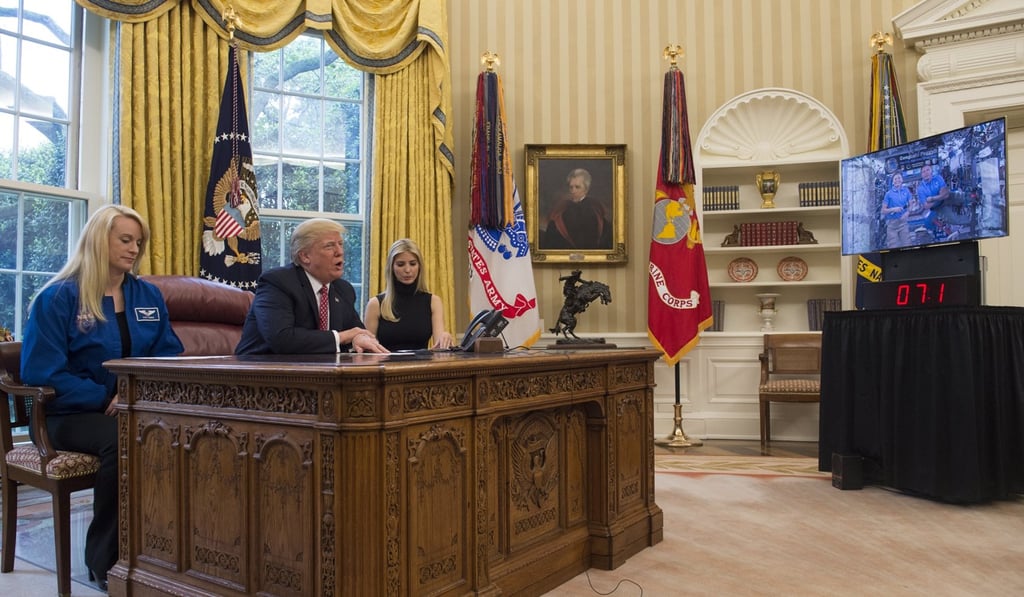US President DonaldTrump, Nasa astronaut Kate Rubins (left), and Ivanka Trump during a video conference with Nasa astronauts aboard the International Space Station (ISS), in the Oval Office at the White House, on April 24, 2017. Photo: EPA
