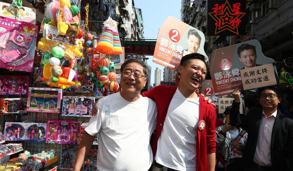 Vincent Cheng (right), who won the Kowloon West seat in the Legislative Council by-election on March 12, thanks voters in Sham Shui Po. Cheng became the first pro-establishment lawmaker to win a single-seat, single-constituency election. Photo: Nora Tam