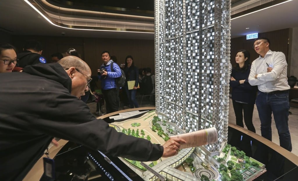 Potential buyers taking a closer look at a model of Wheelock & Co’s Malibu apartment complex at Lohas Park in Tseung Kwan O on 10 March 2018. Photo: Xiaomei Chen