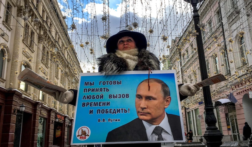 Putin supporters hand out leaflets in downtown Moscow ahead of Sunday’s election. Photo: AFP Putin supporters hand out leaflets in downtown Moscow ahead of Sunday’s election. Photo: AFP