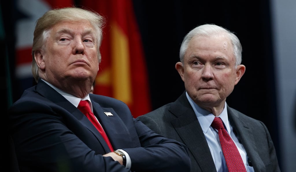 President Donald Trump sits with Attorney General Jeff Sessions during the FBI National Academy graduation ceremony. Sessions fired FBI No. 2 Andrew McCabe late on Friday, just days ahead of the 50-year-old’s retirement. Photo: AP