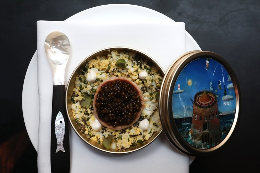 Oscietra caviar on blini with chopped egg, chives and capers with sour cream. Photo: Jonathan Wong