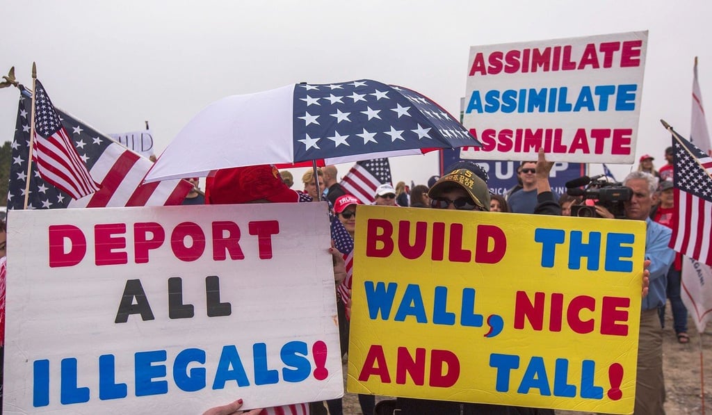 Supporters of US President Donald Trump rally for the president during his visit to see the controversial border wall prototypes on March 13, 2018 in San Diego, California. Photo: Getty Images/AFP Supporters of US President Donald Trump rally for the president during his visit to see the controversial border wall prototypes on March 13, 2018 in San Diego, California. Photo: Getty Images/AFP