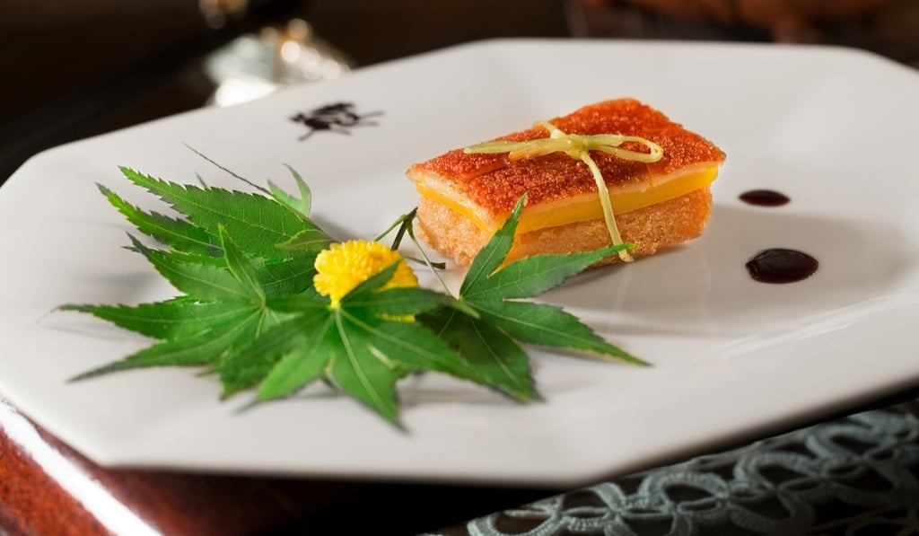 Suckling pig slice with crispbread and mango at Spring Moon