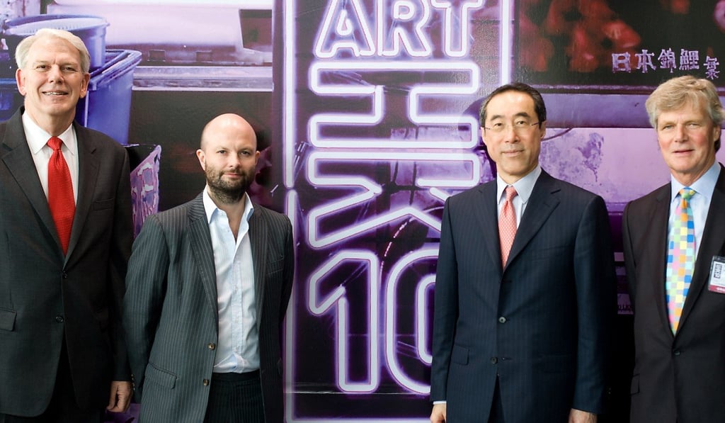 Magnus Renfrew (second from left) and Sandy Angus (right) with Cliff Wallace (left), managing director of the Hong Kong Convention and Exhibition Centre, and Henry Tang, chief secretary of the Hong Kong government, at ART HK in 2010. Photo: ART HK