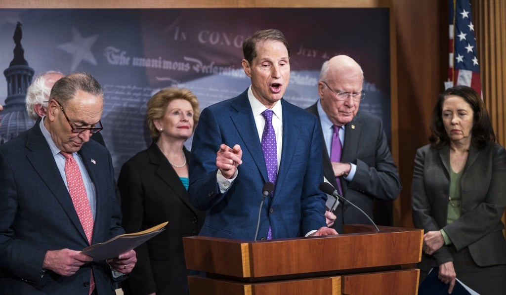 Democratic Senator Ron Wyden from Oregon (centre, at an infrastructure press conference March 7) has called on Facebook to account for how UK-based political firm Cambridge Analytica got and kept data on 50 million Facebook users without their consent. Photo: EPA-EFE Democratic Senator Ron Wyden from Oregon (centre, at an infrastructure press conference March 7) has called on Facebook to account for how UK-based political firm Cambridge Analytica got and kept data on 50 million Facebook users without their consent. Photo: EPA-EFE