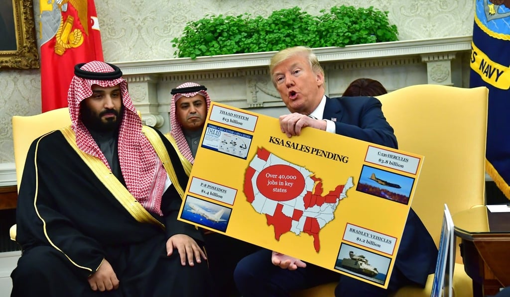 US President Donald Trump holds up a chart of military hardware sales as he meets with Crown Prince Mohammed bin Salman. Photo: Pool via EPA-EFE US President Donald Trump holds up a chart of military hardware sales as he meets with Crown Prince Mohammed bin Salman. Photo: Pool via EPA-EFE